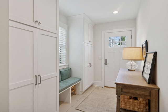 mudroom featuring light tile patterned flooring and recessed lighting