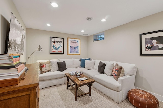 living area with recessed lighting, visible vents, and baseboards