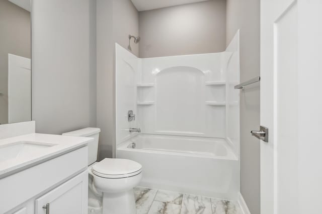 bathroom with marble finish floor, vanity, toilet, and shower / bath combination