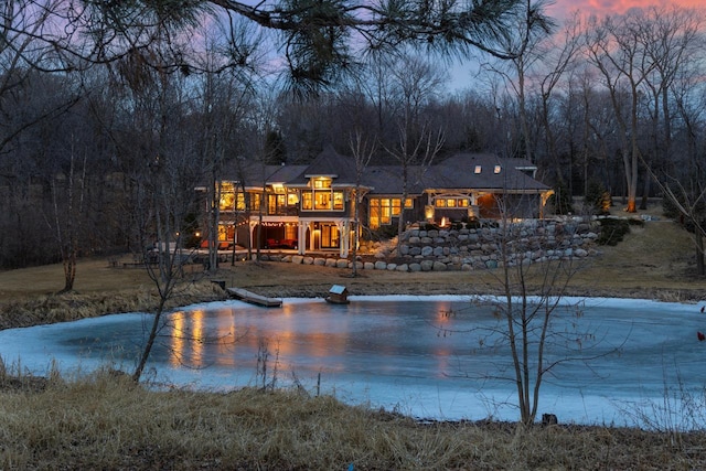 exterior space featuring a wooded view