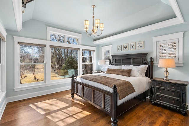 bedroom with dark wood-style floors, multiple windows, and a chandelier