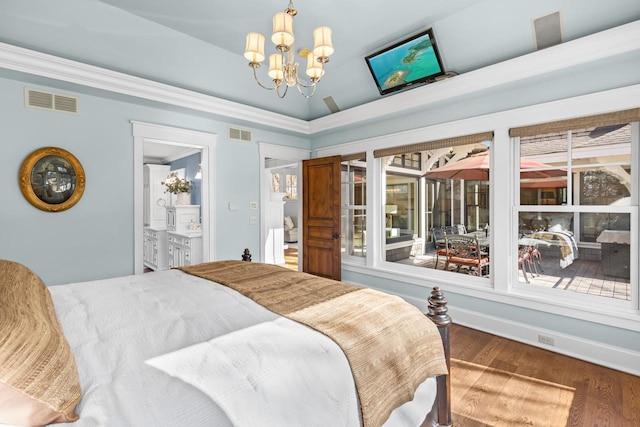 bedroom featuring ornamental molding, wood finished floors, visible vents, and a chandelier