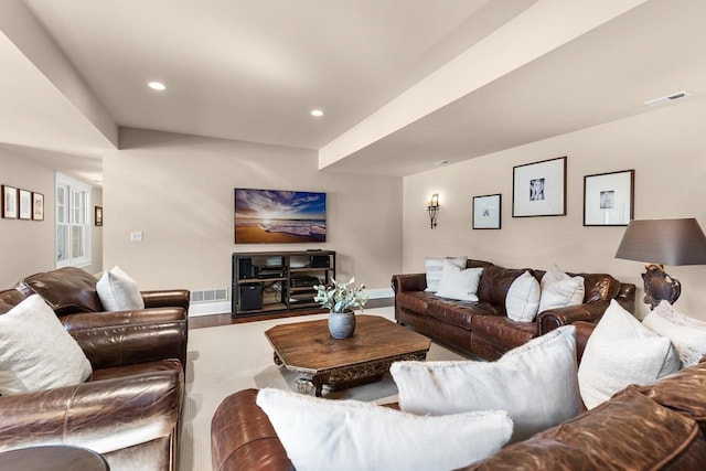 living room featuring wood finished floors, recessed lighting, visible vents, and baseboards