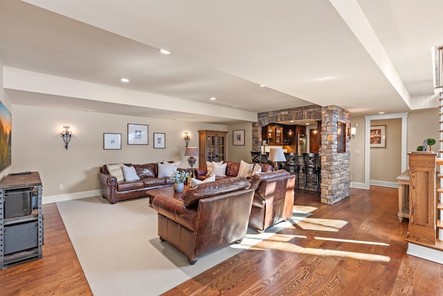 living area with recessed lighting, baseboards, and wood finished floors