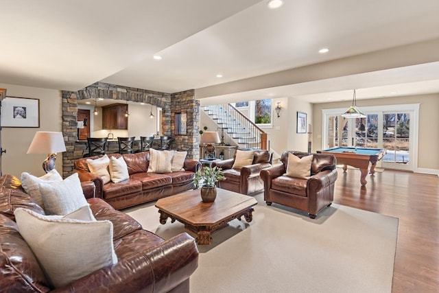 living room featuring billiards, plenty of natural light, wood finished floors, recessed lighting, and stairs