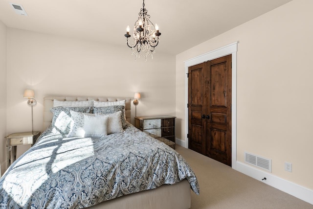 bedroom with a notable chandelier, visible vents, baseboards, and carpet