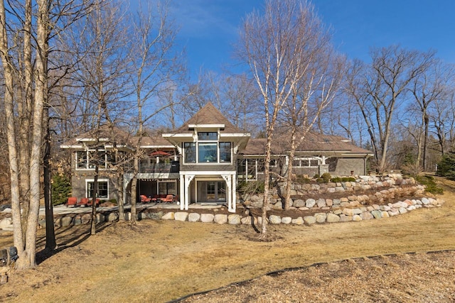 view of front facade with a patio and a deck