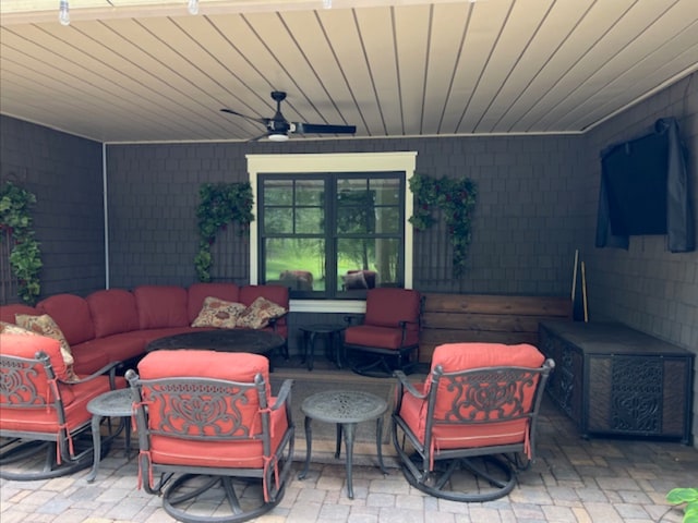 view of patio featuring outdoor lounge area and ceiling fan