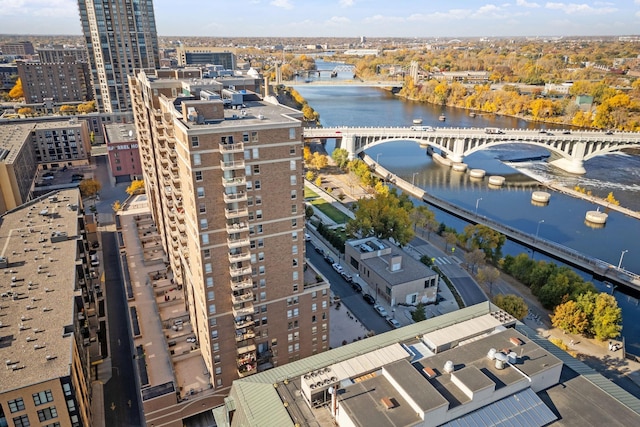 birds eye view of property with a view of city and a water view