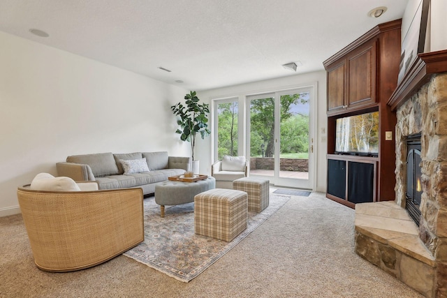 living room featuring carpet and a fireplace