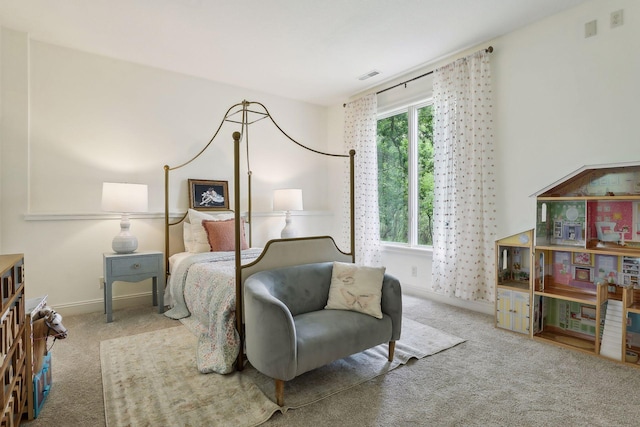 bedroom with visible vents, carpet floors, and baseboards