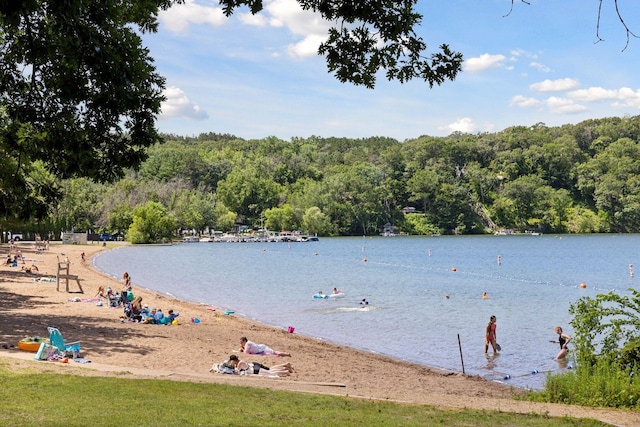 property view of water featuring a forest view