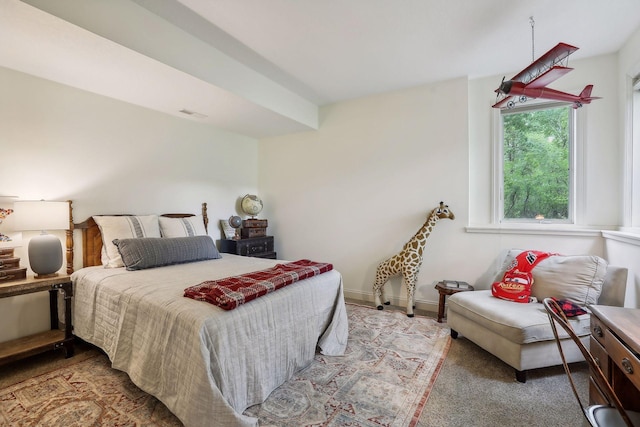 carpeted bedroom with visible vents and baseboards