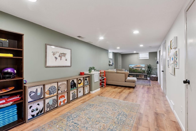 interior space with recessed lighting, wood finished floors, visible vents, and baseboards