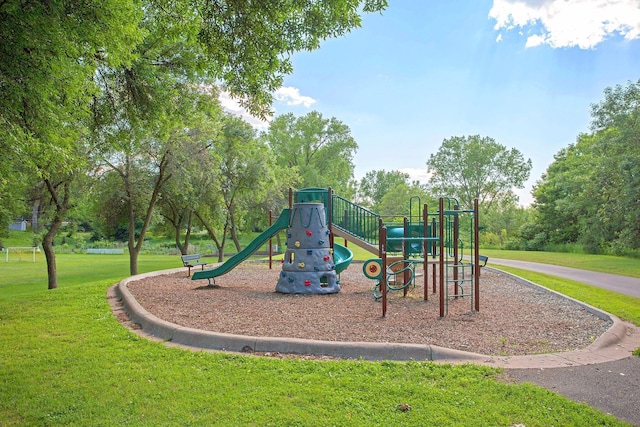 community play area featuring a lawn