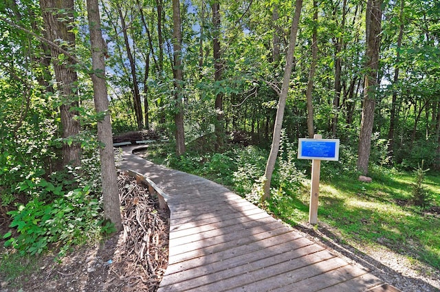 view of community with a wooded view