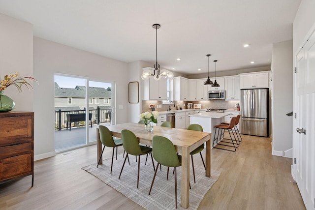 dining room featuring visible vents, recessed lighting, light wood-type flooring, and baseboards