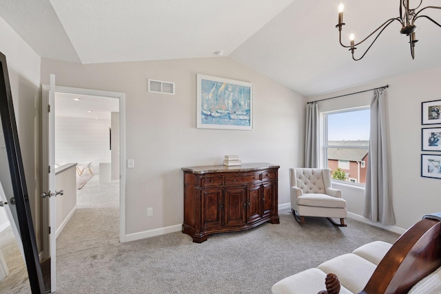 living area featuring visible vents, light carpet, lofted ceiling, baseboards, and a chandelier