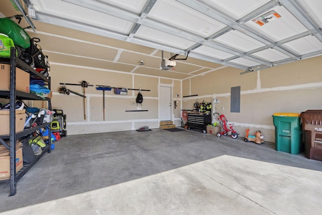 garage with electric panel and a garage door opener