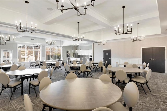 carpeted dining space featuring crown molding, beamed ceiling, a decorative wall, and coffered ceiling