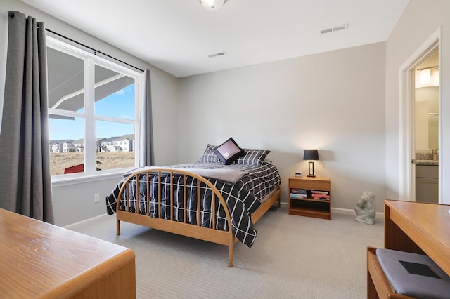 bedroom featuring visible vents, baseboards, and carpet floors