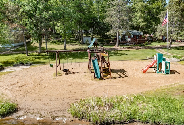 community jungle gym with a yard