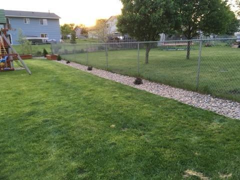 view of yard with a playground and fence