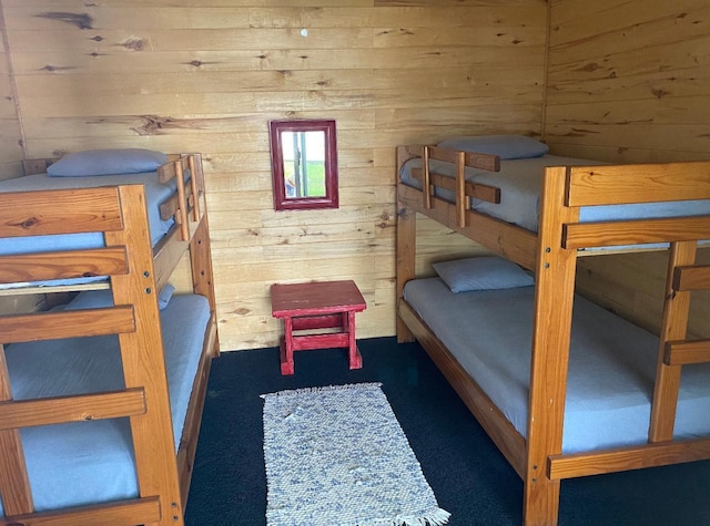 bedroom with wood walls