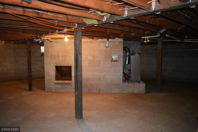 unfinished below grade area featuring heating unit