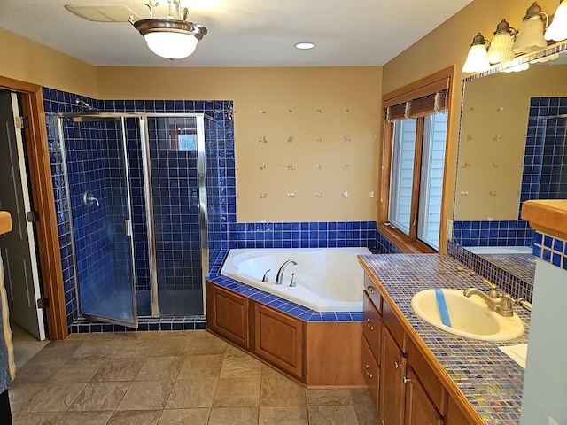 full bath featuring a bath, a shower stall, and vanity