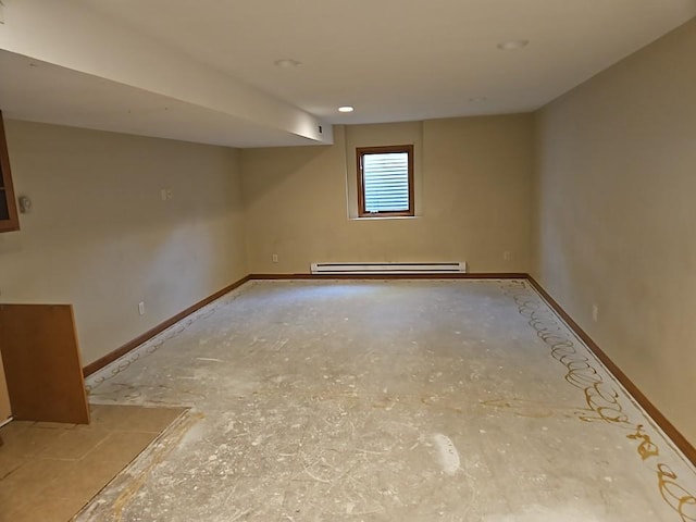 basement with a baseboard heating unit and baseboards