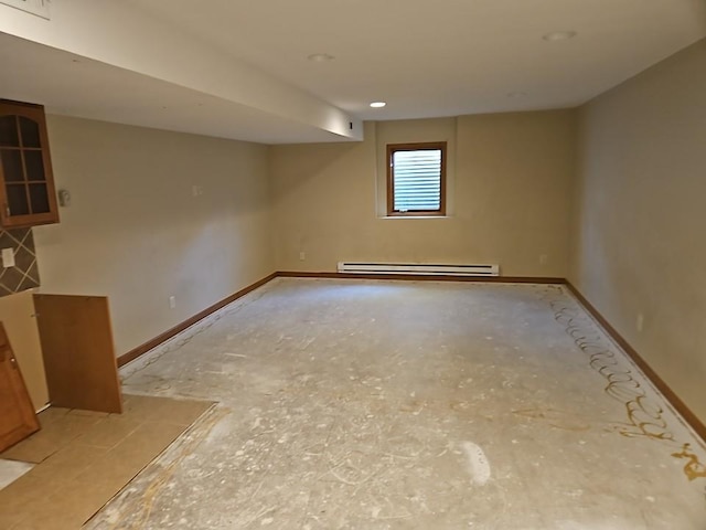 below grade area with baseboards and a baseboard radiator