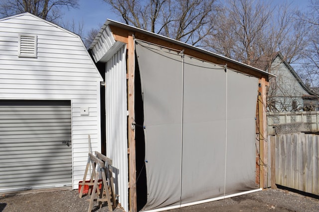 view of shed with fence