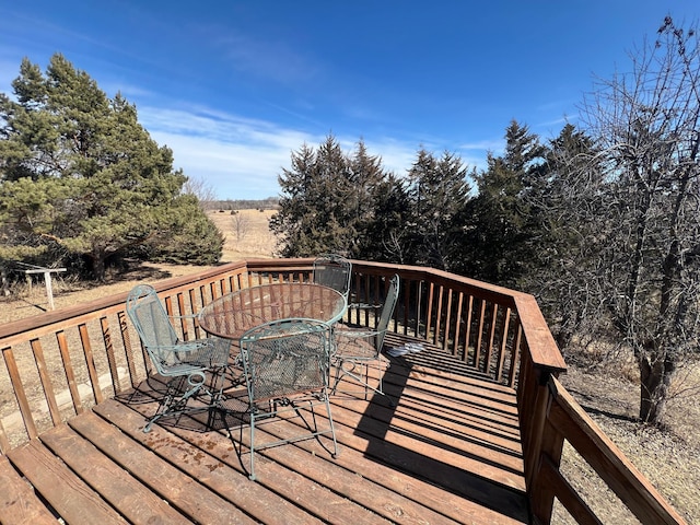 wooden deck with outdoor dining area