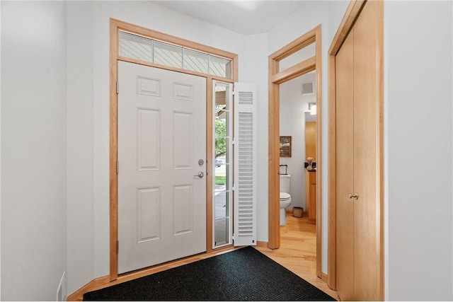 foyer entrance with wood finished floors