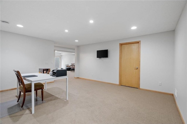 office area with recessed lighting, baseboards, and light carpet