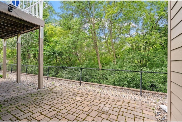 view of patio / terrace featuring fence