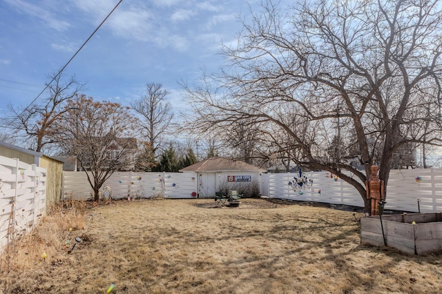 view of yard featuring a vegetable garden and a fenced backyard