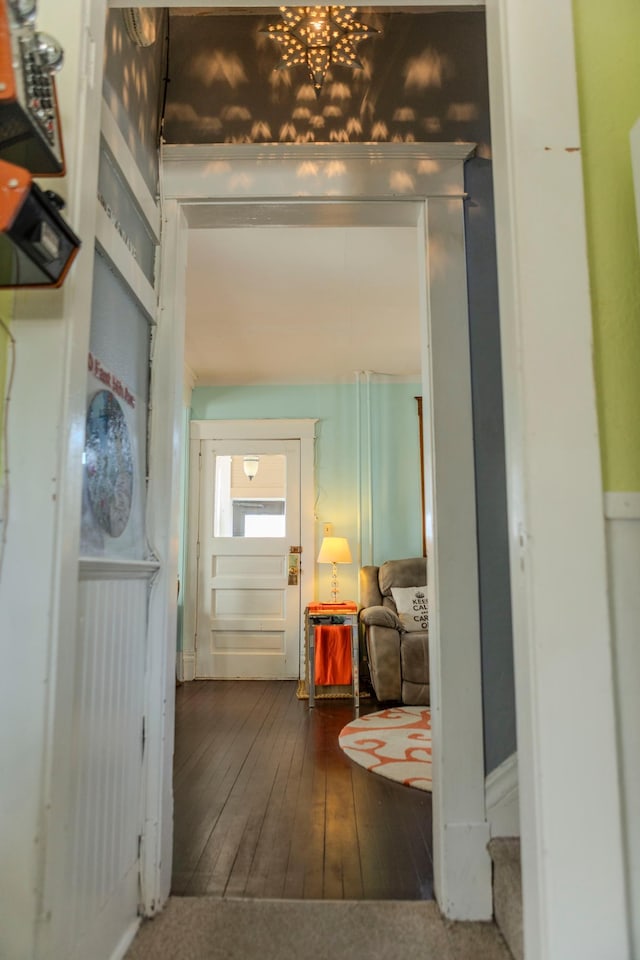 hall with hardwood / wood-style flooring