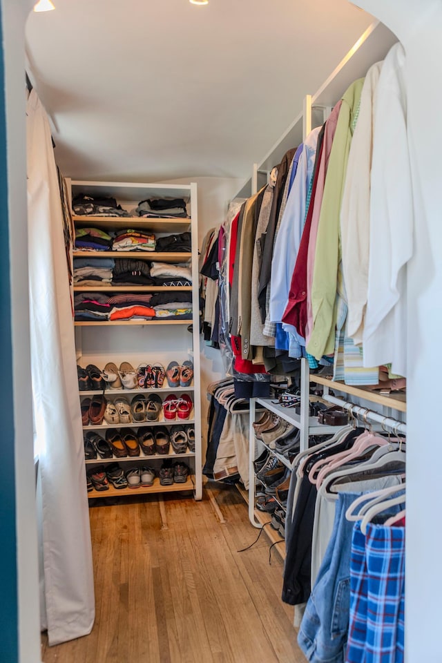 spacious closet featuring hardwood / wood-style flooring