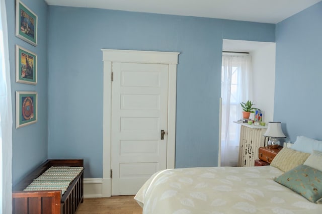 bedroom featuring wood finished floors