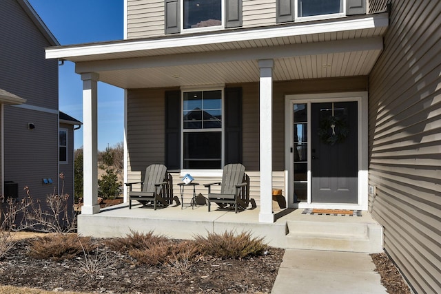 entrance to property featuring covered porch