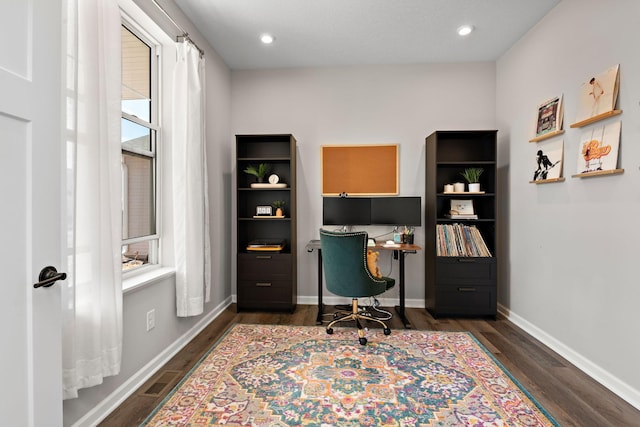 office featuring visible vents, recessed lighting, dark wood-type flooring, and baseboards