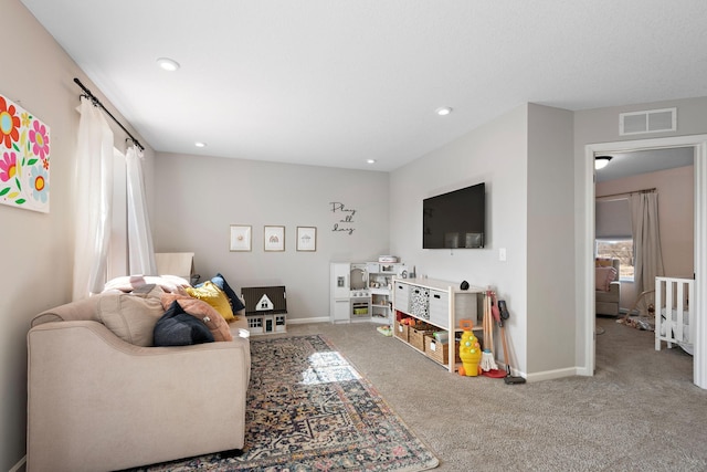 living room featuring recessed lighting, carpet flooring, baseboards, and visible vents