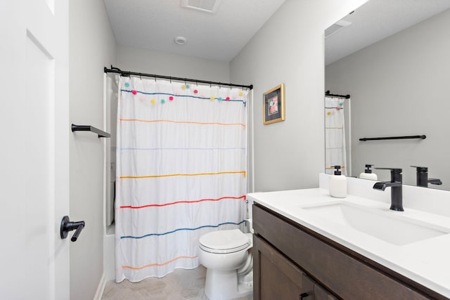 bathroom featuring vanity, toilet, and shower / bath combo with shower curtain