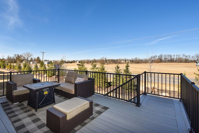 wooden deck with an outdoor living space with a fire pit