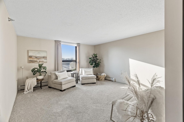carpeted living room featuring a textured ceiling, a baseboard heating unit, and baseboard heating