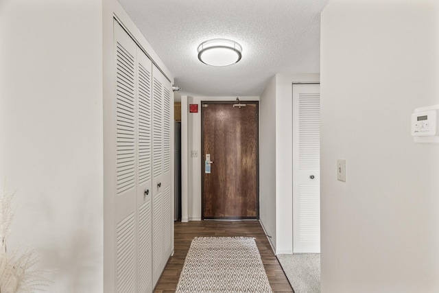 6615 Lake Shore Dr S Unit 515, Richfield, MN 55423 - hallway with a textured ceiling, wood finished floors, and baseboards