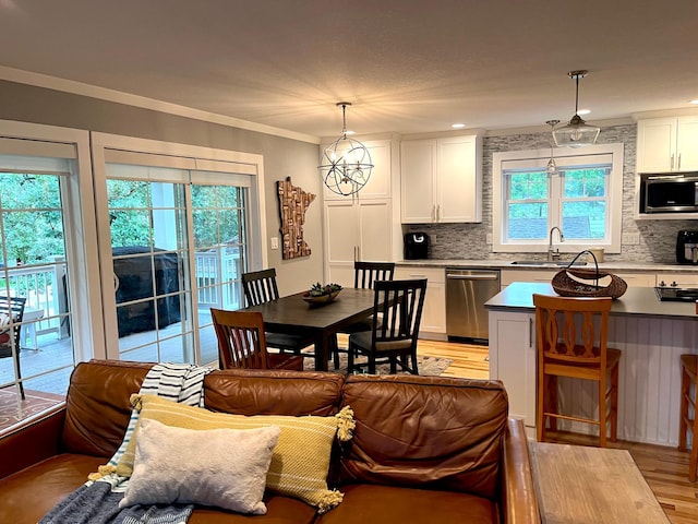 114 Bay View Rd, Otter Tail Twp, MN 56571 - dining room with light wood finished floors and ornamental molding