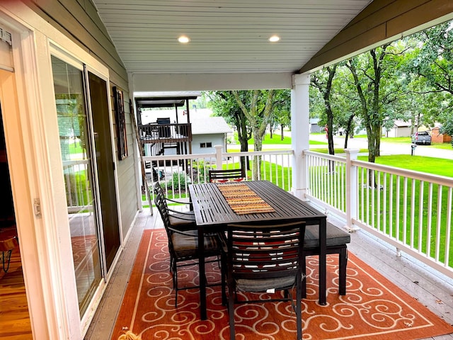 114 Bay View Rd, Otter Tail Twp, MN 56571 - wooden deck with a yard, a porch, and outdoor dining area